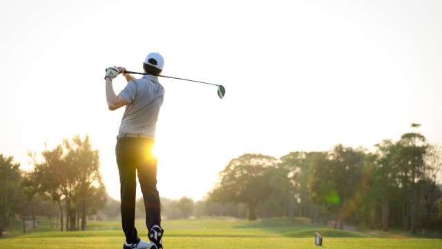 Man swinging a golf club