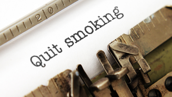 Paper in an old type-writer that says 'Quit smoking'