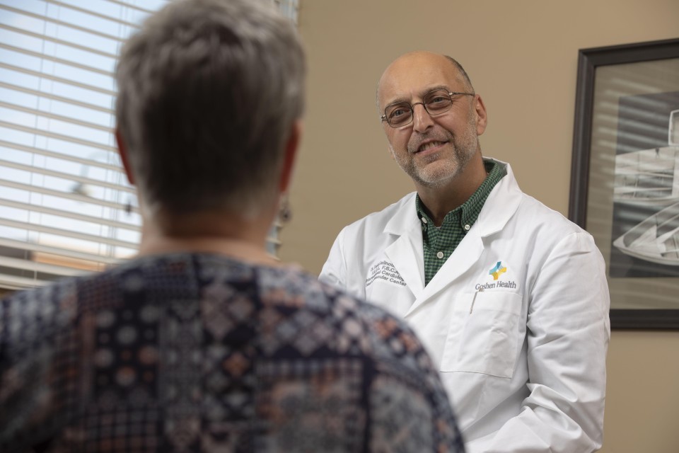 Doctor in a white coat talking to patient