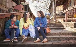 Mother and children sitting on steps