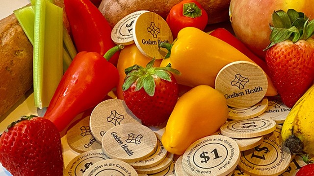 Fruits, vegetables and round wooden tokens