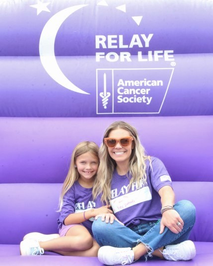 Mother and child sitting on an inflatable chair