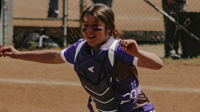 Female softball athlete on the ball field.
