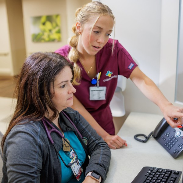 Goshen Health Colleagues looking at a computer screen