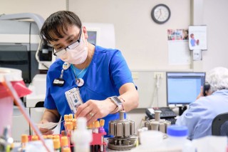 Woman working in a laboratory with test tubes