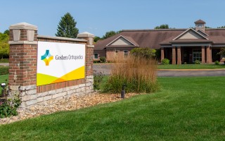 Goshen Orthopedics building with sign in front lawn