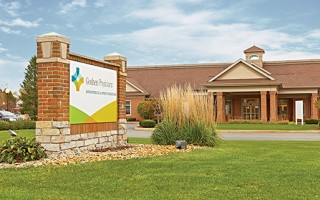 Goshen Rehabilitation building with sign in front lawn