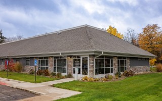 Goshen Physicians Family Medicine with OB Park building with sidewalk in front