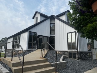 Sidewalk leading up to odd shaped building