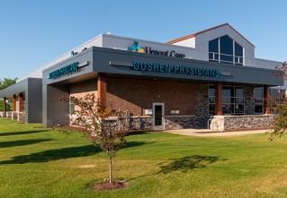 Urgent Care Goshen Physicians building with small tree in front yard