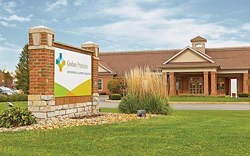 Goshen Rehabilitation building with sign in front lawn