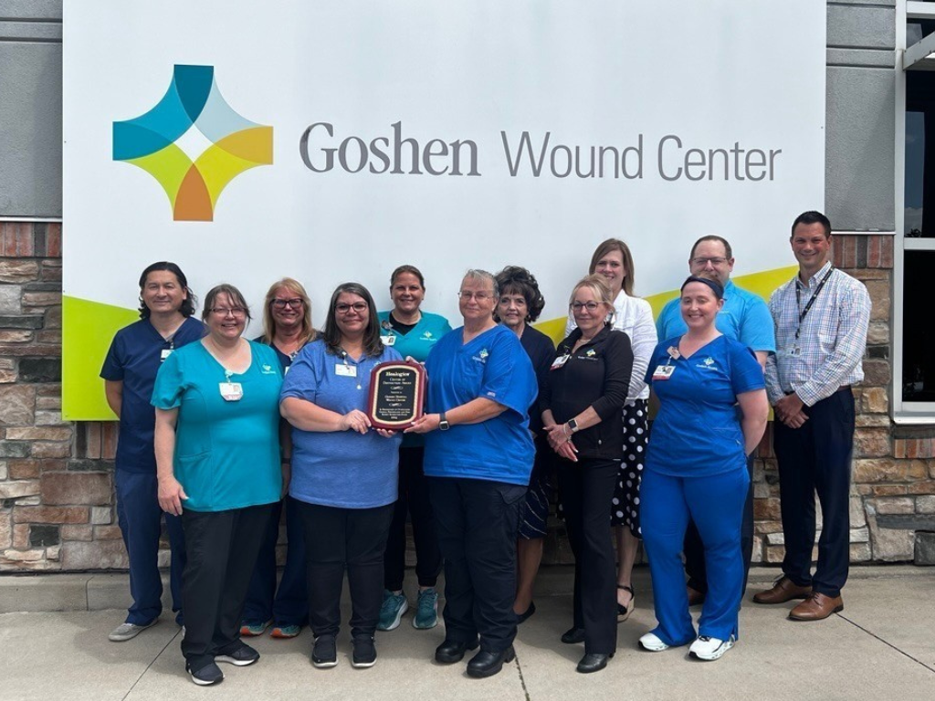 Colleagues at the Goshen Wound Center holding an award