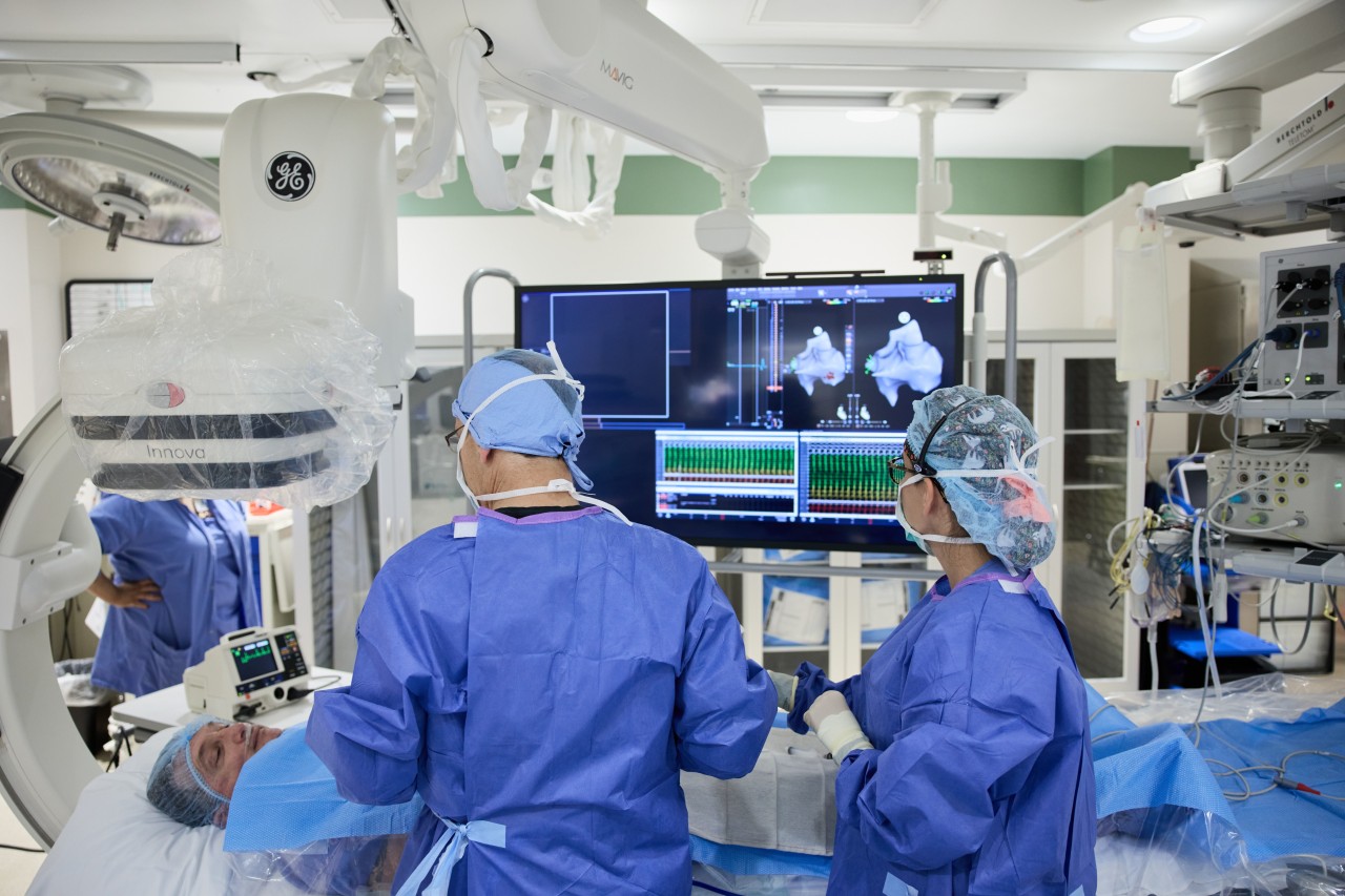 Doctors performing a procedure in a procedure room
