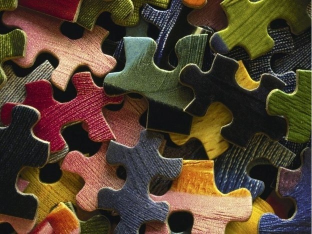 Puzzle pieces laying in a pile