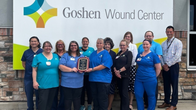 Colleagues at the Goshen Wound Center holding an award