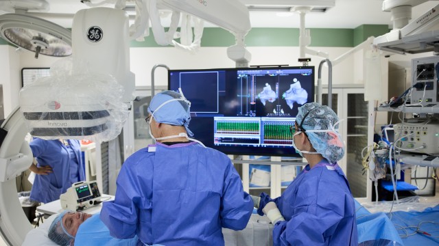 Doctors performing a procedure in a procedure room