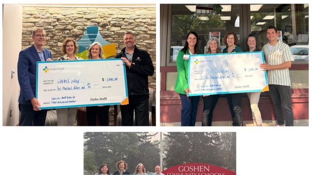 Goshen Health nurses holding three large checks to present to the community