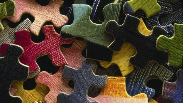 Puzzle pieces laying in a pile