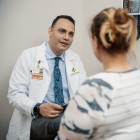 Doctor and patient sitting in an exam room talking