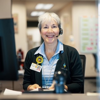 Receptionist sitting at desk