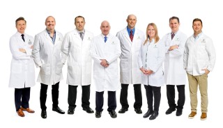 Goshen Orthopedics staff standing in white coats
