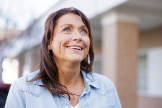 Woman looking up and smiling
