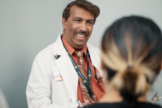 Doctor smiling at patient