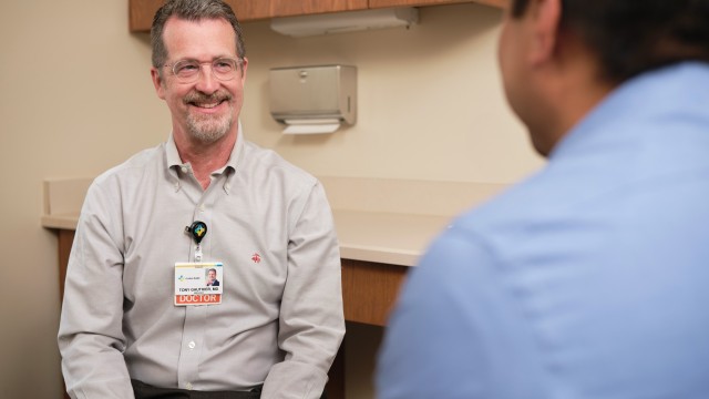 Doctor and patient sitting across from each other in exam room