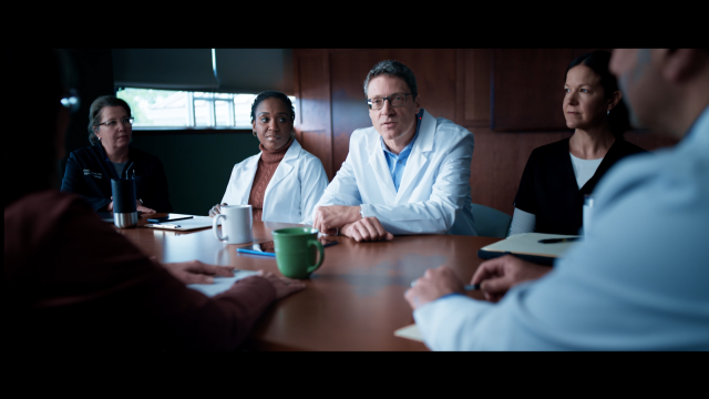 Doctors having a discussion while sitting at a table