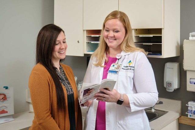 Doctor discussing a brochure with her patient