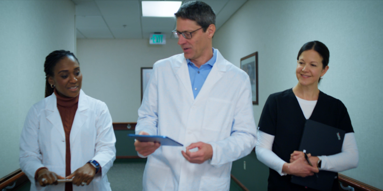 Three doctors walking in the hallway