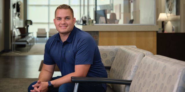 Man sitting in a waiting room chair